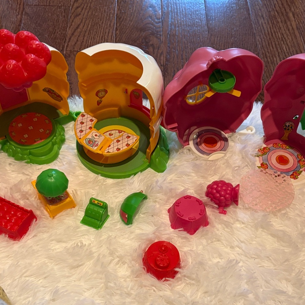 2 playsets. Strawberry shortcake. Raspberry’s soda shop. Strawberry’s house.